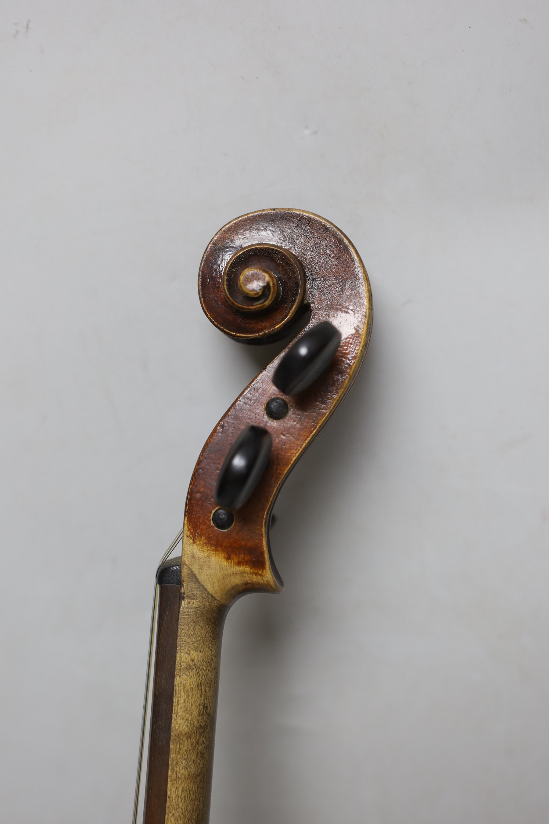 A 19th century cased violin, back measures 36cm excl button